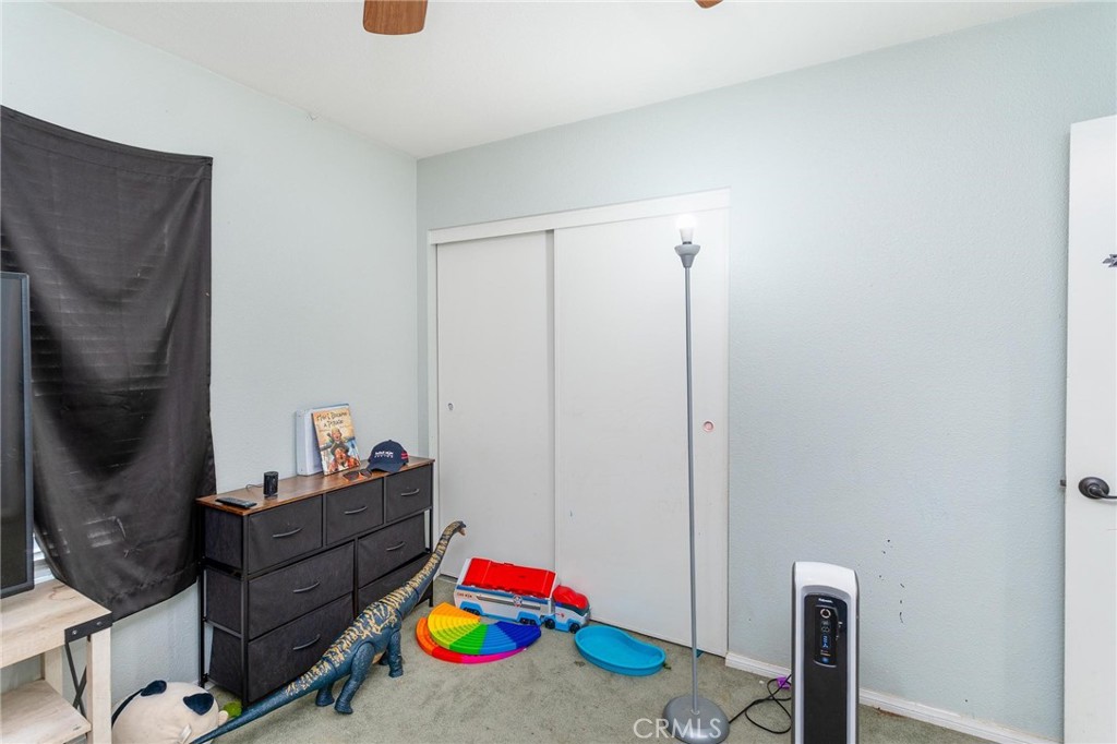 81901 Victoria Street Indio, CA 92201 - Photo 22 of 29 a room with toys and wooden floor