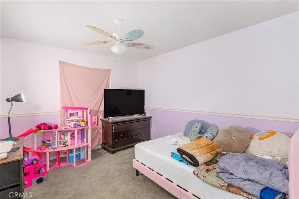 81901 Victoria Street Indio, CA 92201 - Photo 23 of 29 a living room with furniture and a flat screen tv