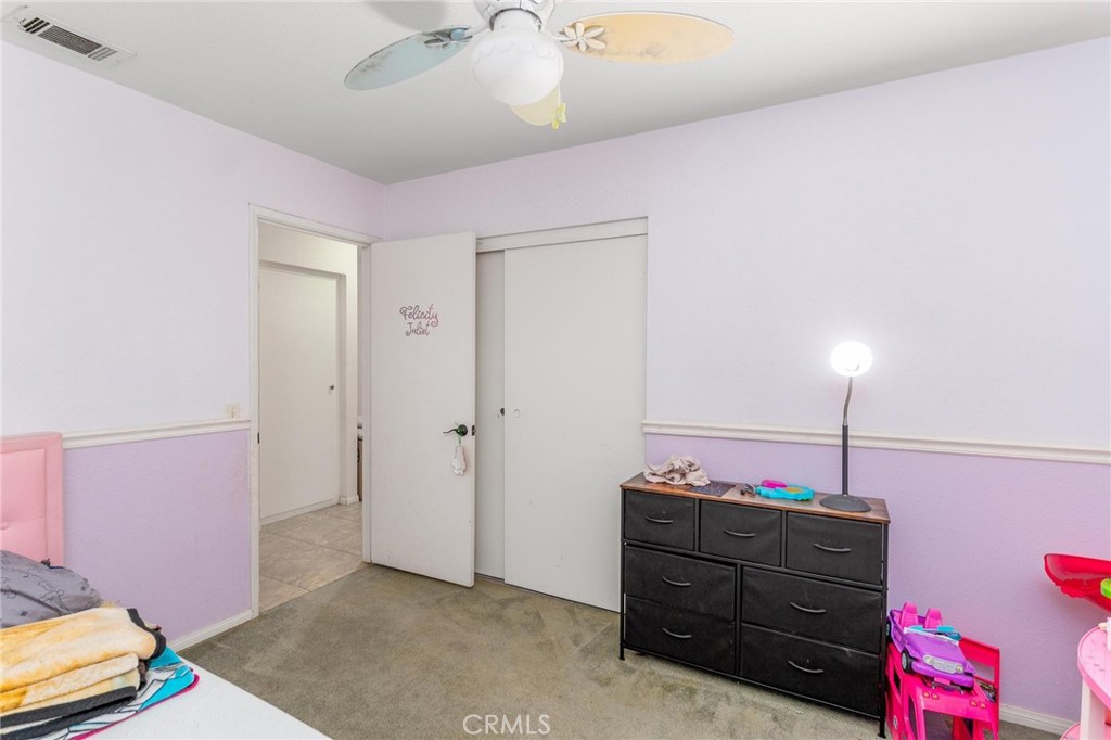 81901 Victoria Street Indio, CA 92201 - Photo 24 of 29 a room that has a bed and a closet