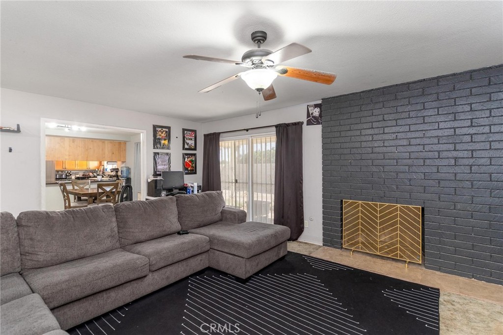 81901 Victoria Street Indio, CA 92201 - Photo 8 of 29 a living room with furniture and a chandelier