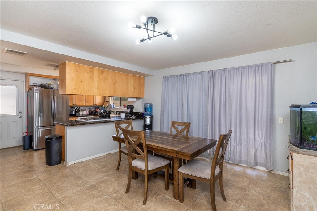 81901 Victoria Street Indio, CA 92201 - Photo 9 of 29 a view of a dining room with furniture window and outside view