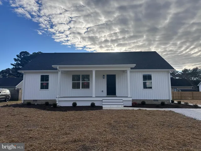 a house with trees in the background