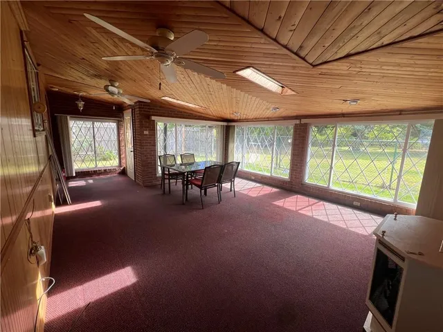 a livingroom with furniture and a large window