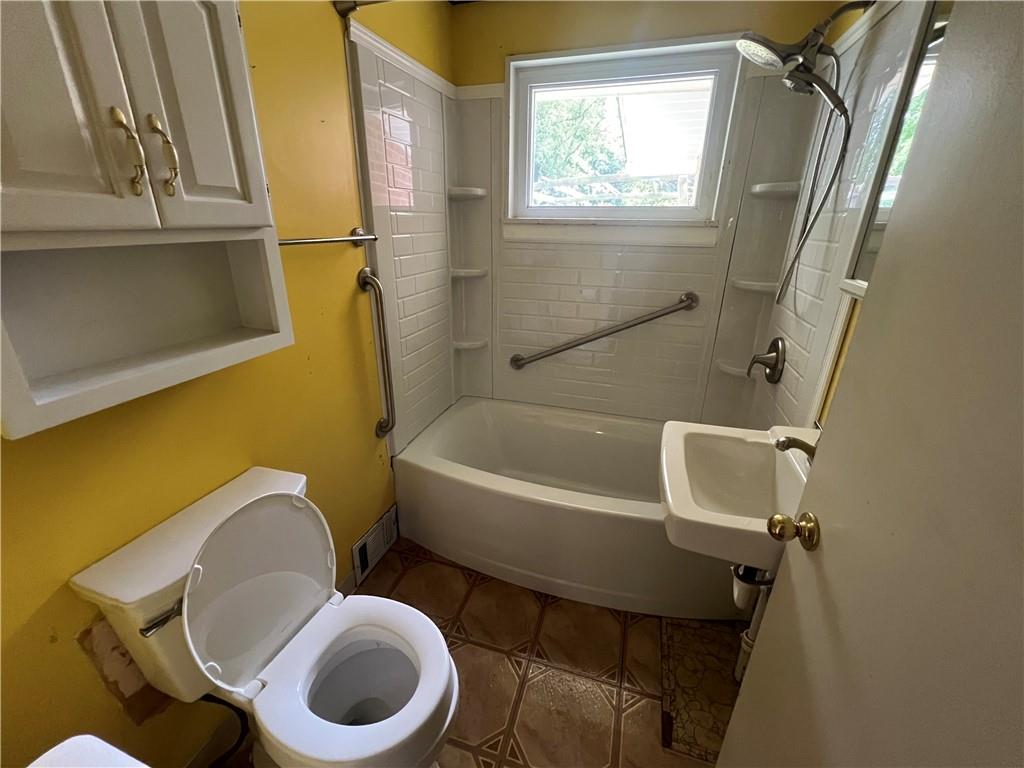 455 Tuscarawas Road Beaver, PA 15009 - Photo 10 of 18 a bathroom with a sink mirror bathtub and toilet