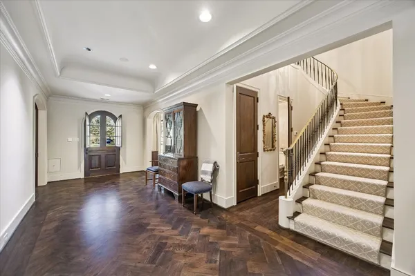 a very nice looking dining room with a large dining table and chairs