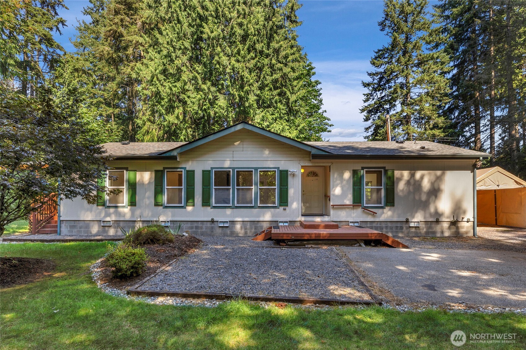22222 49th Avenue Southeast Bothell, WA 98021 - Photo 1 of 37 a front view of a house with a yard