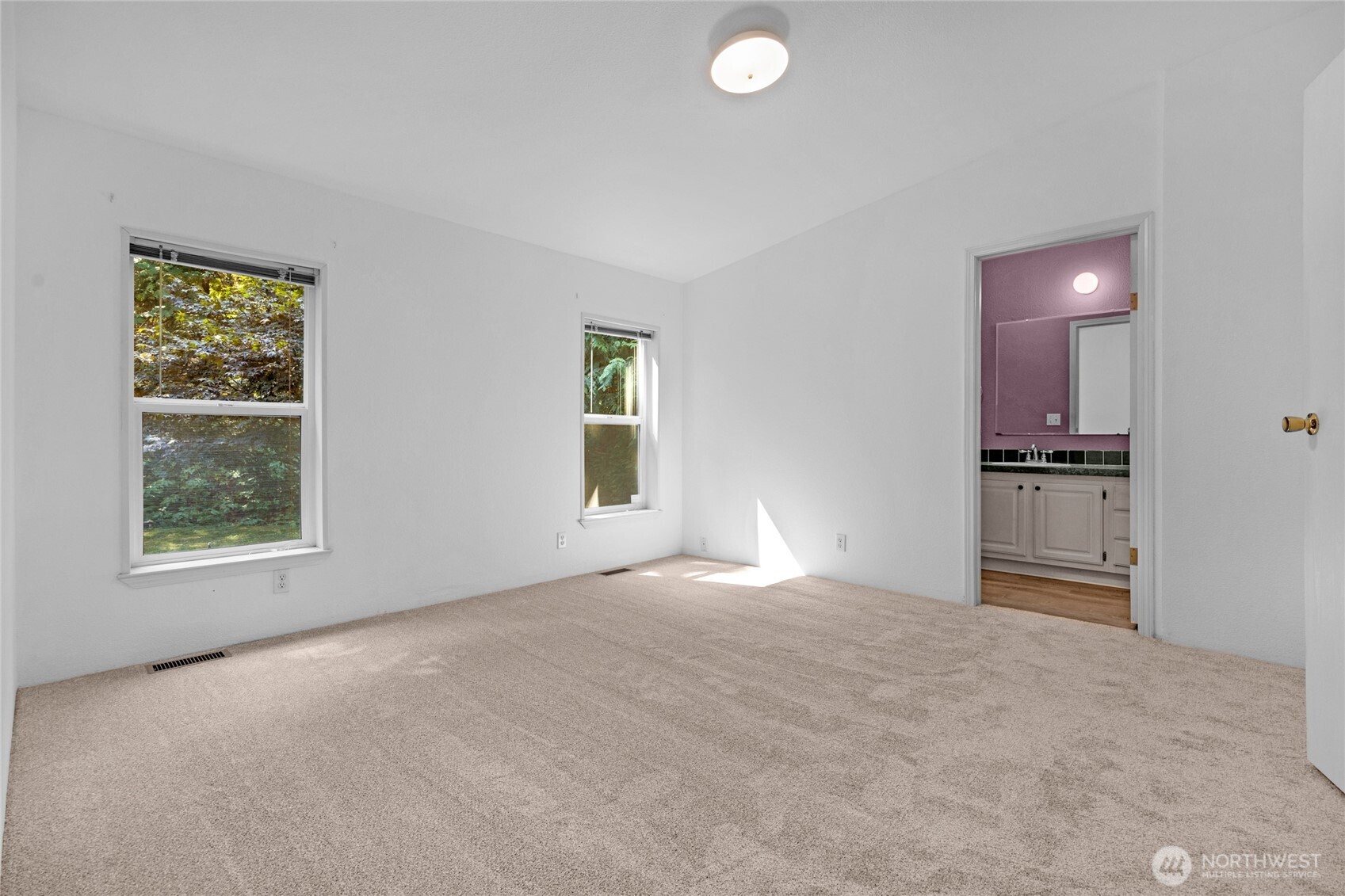 22222 49th Avenue Southeast Bothell, WA 98021 - Photo 11 of 37 an empty room with windows and closet
