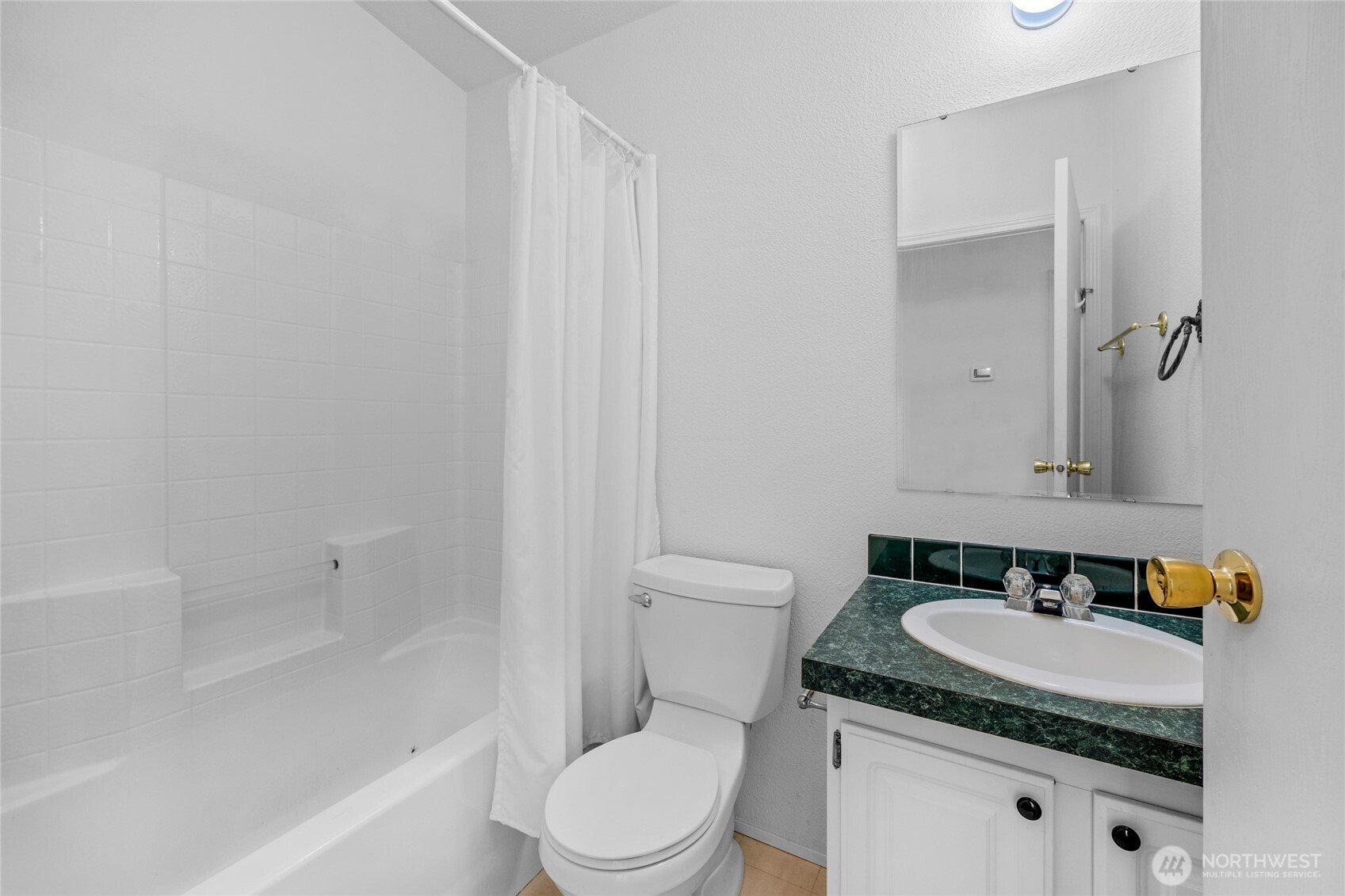 22222 49th Avenue Southeast Bothell, WA 98021 - Photo 17 of 37 a bathroom with a granite countertop sink toilet and shower