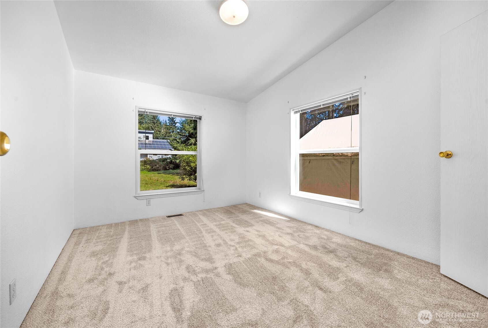 22222 49th Avenue Southeast Bothell, WA 98021 - Photo 19 of 37 an empty room with windows and window