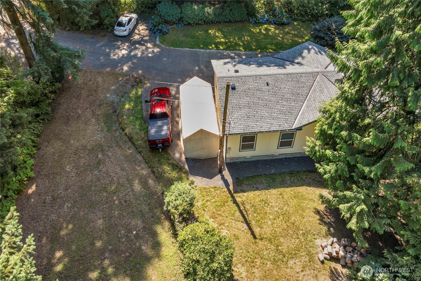 22222 49th Avenue Southeast Bothell, WA 98021 - Photo 23 of 37 a aerial view of a house with swimming pool and large trees
