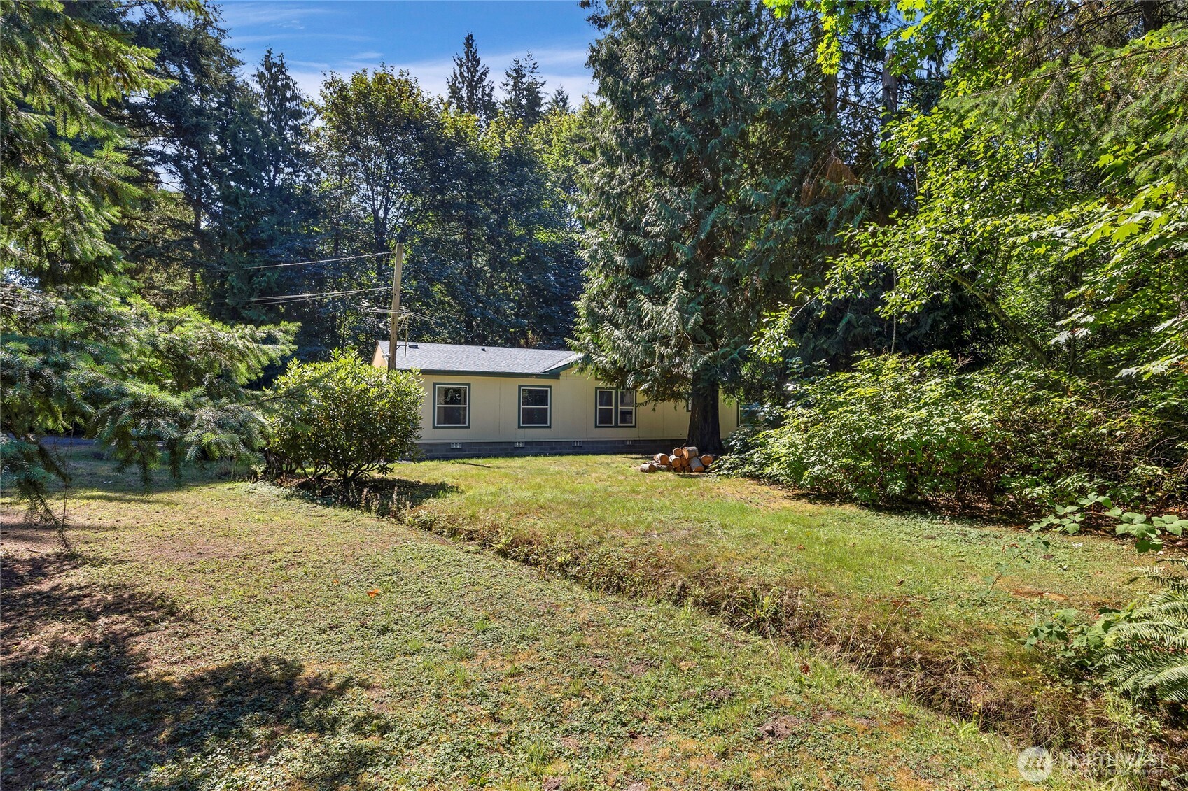 22222 49th Avenue Southeast Bothell, WA 98021 - Photo 28 of 37 a yellow house with trees in front of it