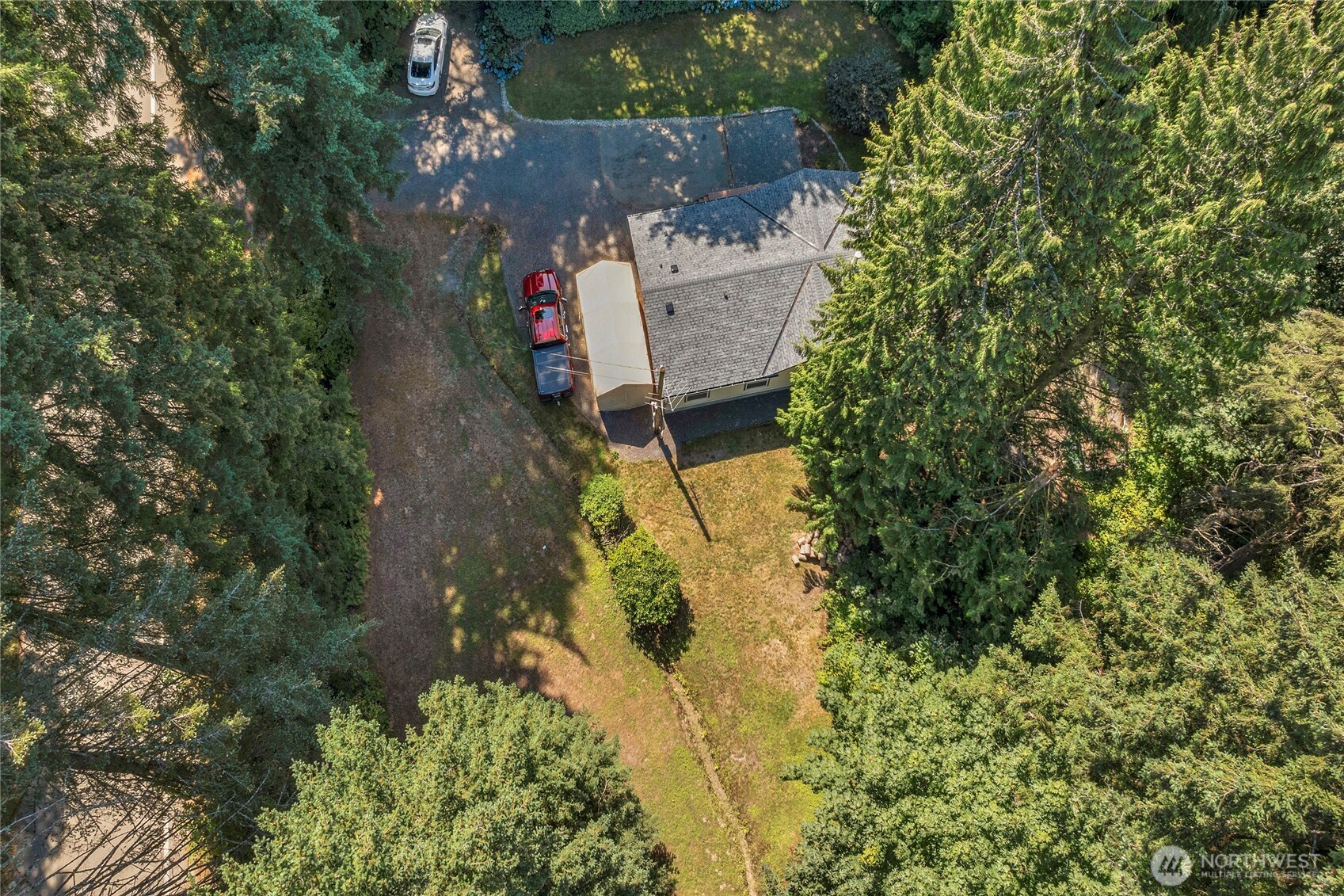 22222 49th Avenue Southeast Bothell, WA 98021 - Photo 36 of 37 an aerial view of a house with a yard and large trees