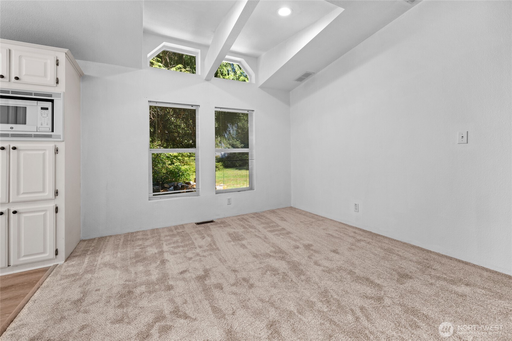 22222 49th Avenue Southeast Bothell, WA 98021 - Photo 6 of 37 an empty room with windows