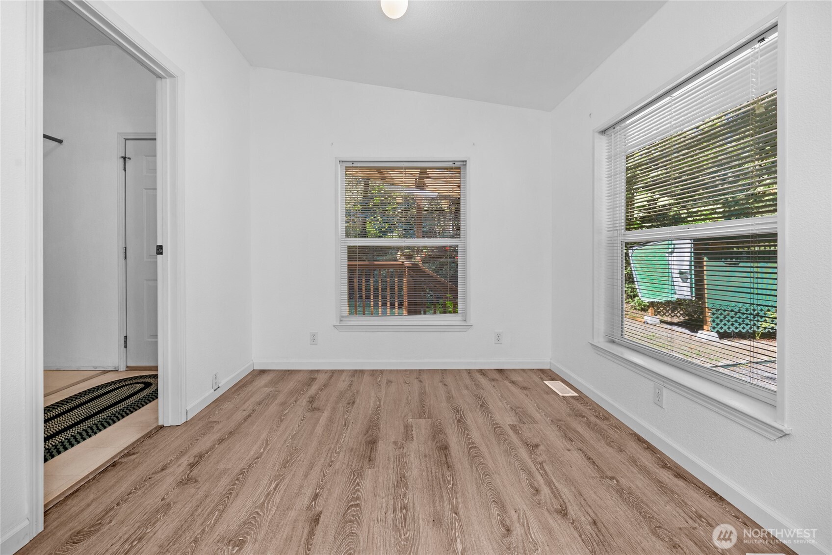 22222 49th Avenue Southeast Bothell, WA 98021 - Photo 10 of 37 a view of wooden floor and windows in a room