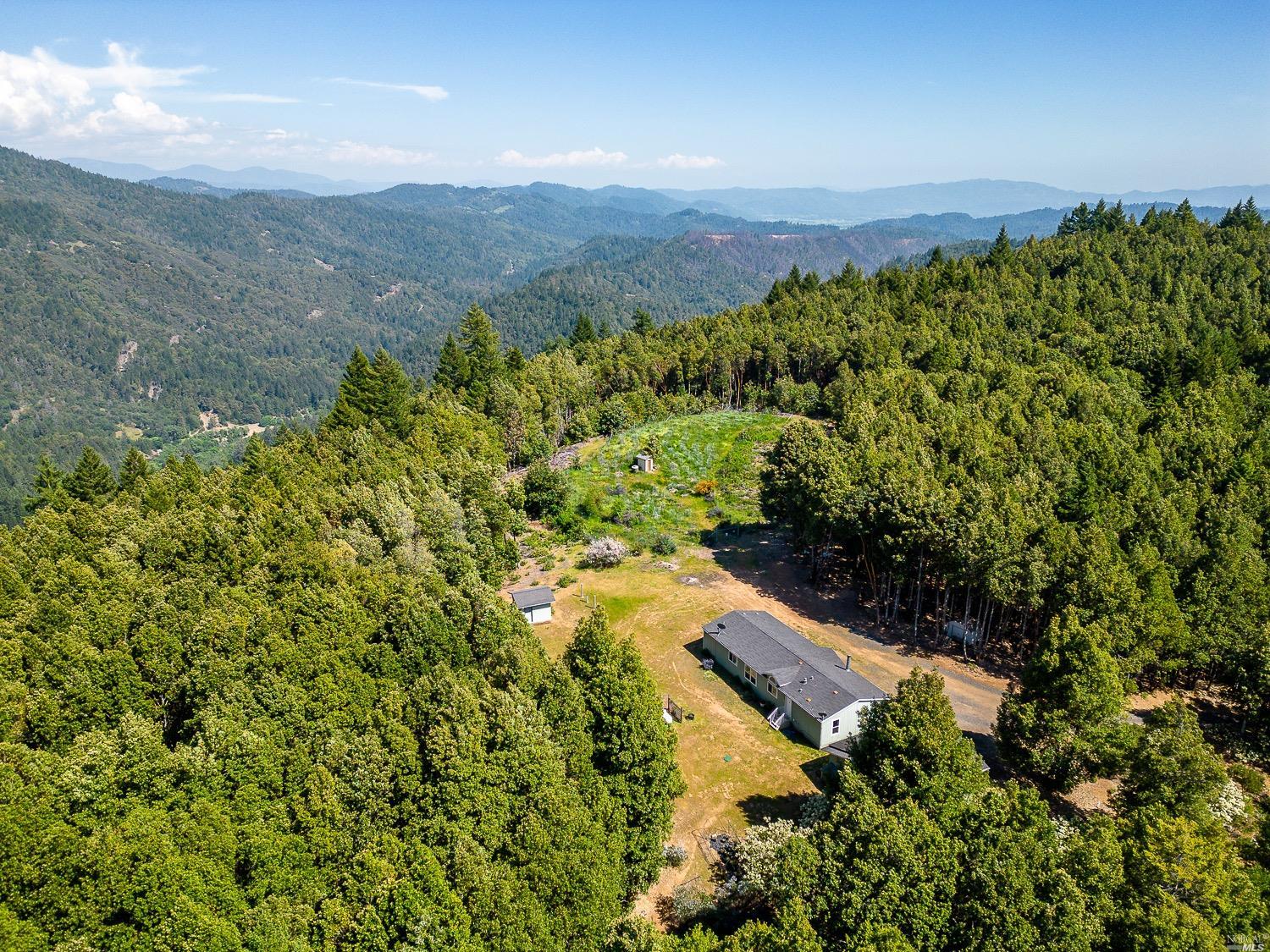 28175 Skyview Road Willits, CA 95490 - Photo 1 of 1 a view of a lush green forest with mountains in the background