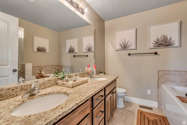 1071 Jamie-Matt Circle Layton, UT 84041 - Photo 15 of 28 Full bath with a garden tub and double vanity