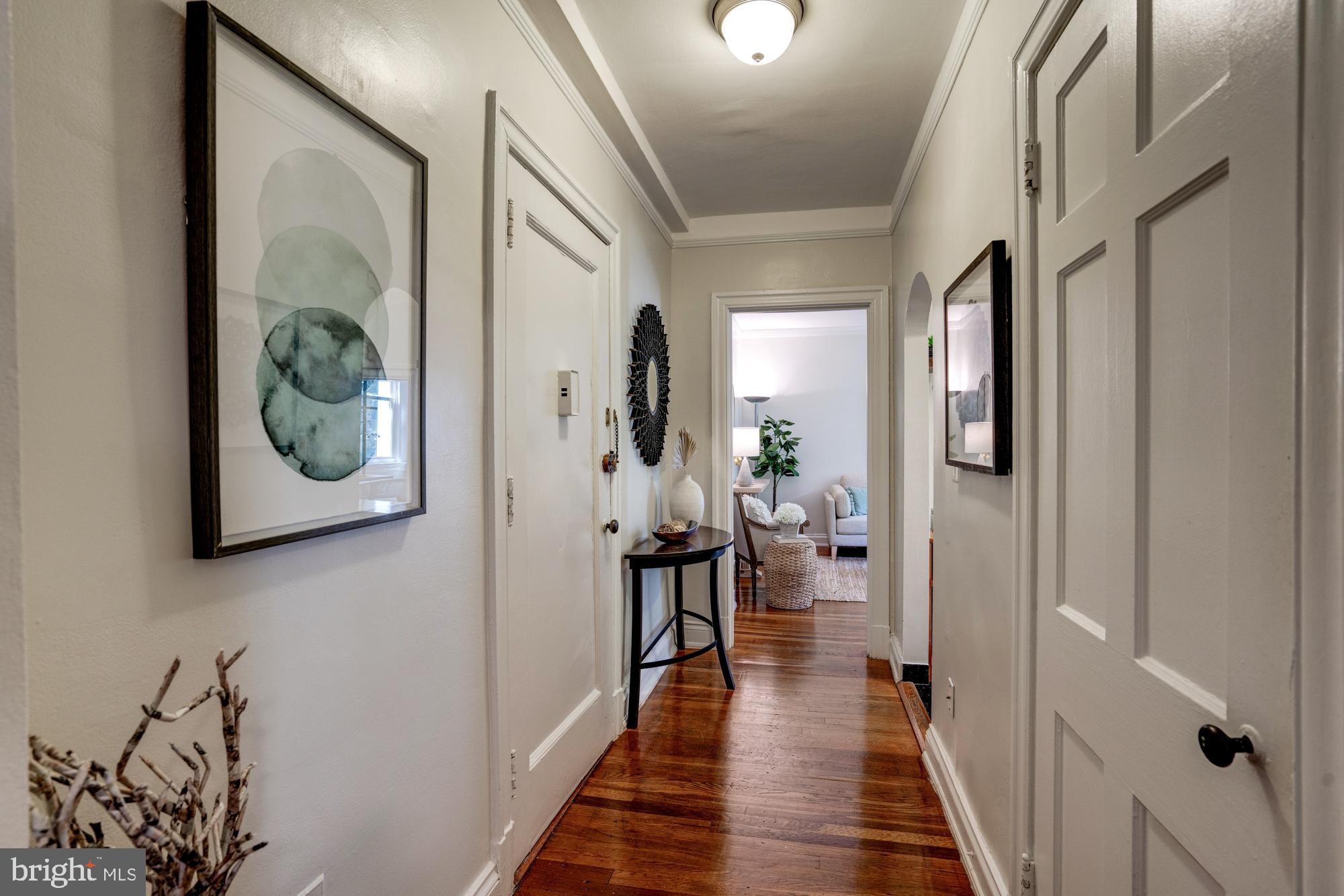 2801 Adams Mill Road Northwest, Unit 113 Washington, DC 20009 - Photo 20 of 28 Hallway with hardwood floors lead to the bedroom