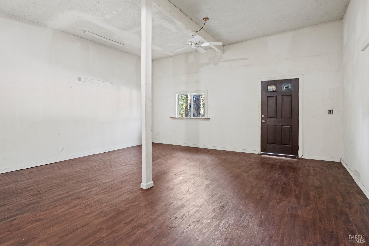 3781 Ridgewood Road Willits, CA 95490 - Photo 15 of 18 a view of an empty room with wooden floor