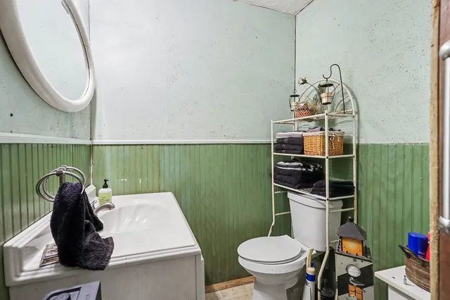 a bathroom with a toilet and a sink