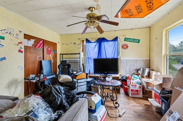 a room with furniture and a flat screen tv