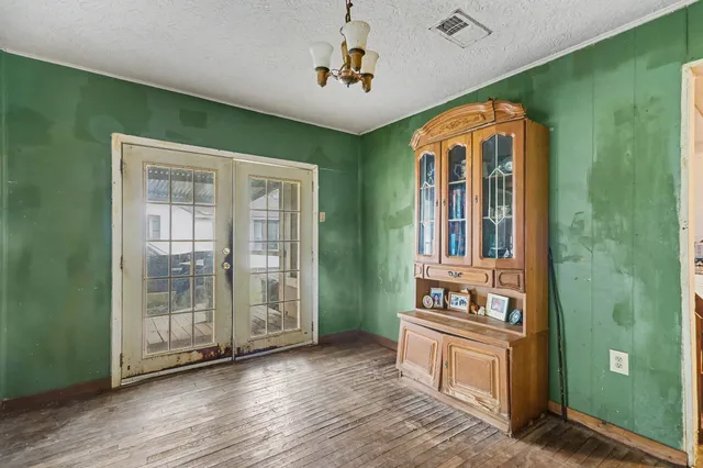 a view of an entryway with wooden floor