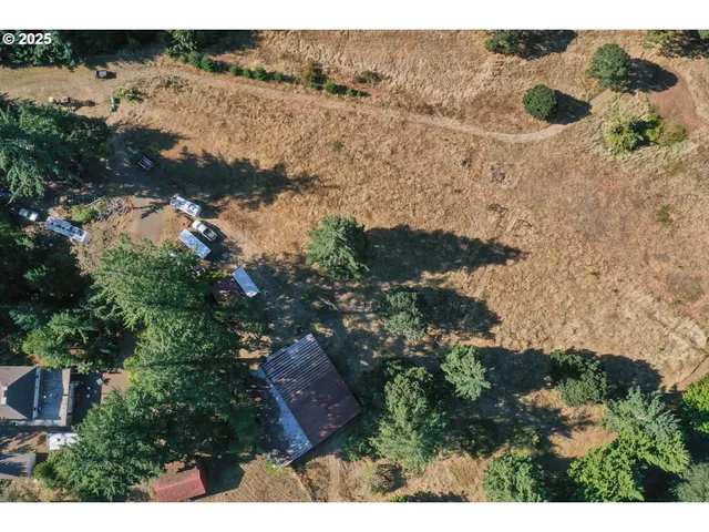 an aerial view of house with yard