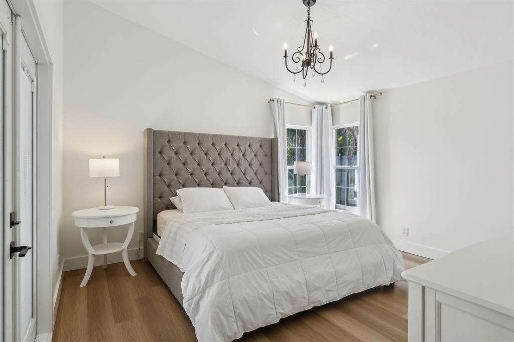 6254 Lucerne Street Jupiter, FL 33458 - Photo 12 of 30 a bedroom with a bed and a window