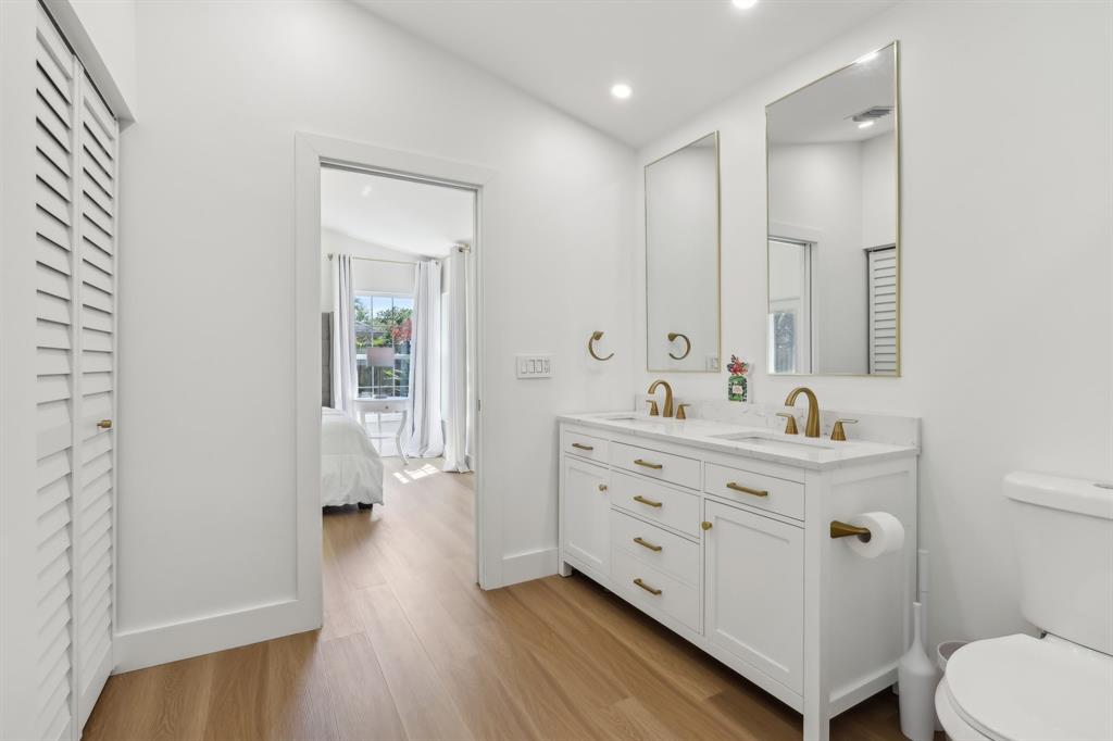 6254 Lucerne Street Jupiter, FL 33458 - Photo 16 of 30 a bathroom with a sink mirror and toilet