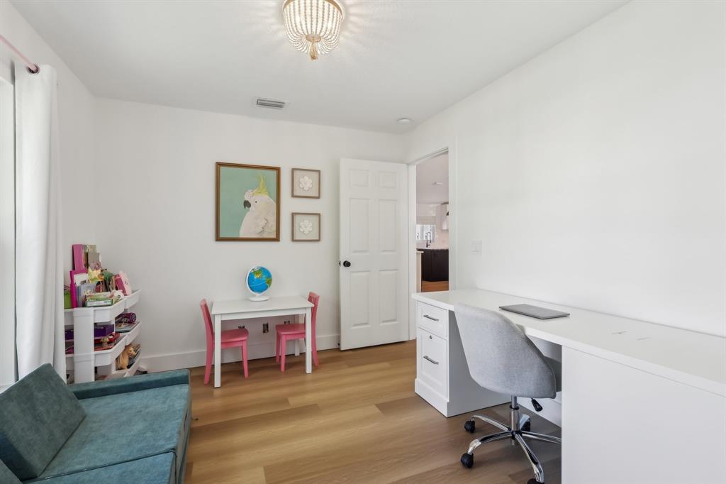 6254 Lucerne Street Jupiter, FL 33458 - Photo 18 of 30 a workspace with furniture cabinet and a couch