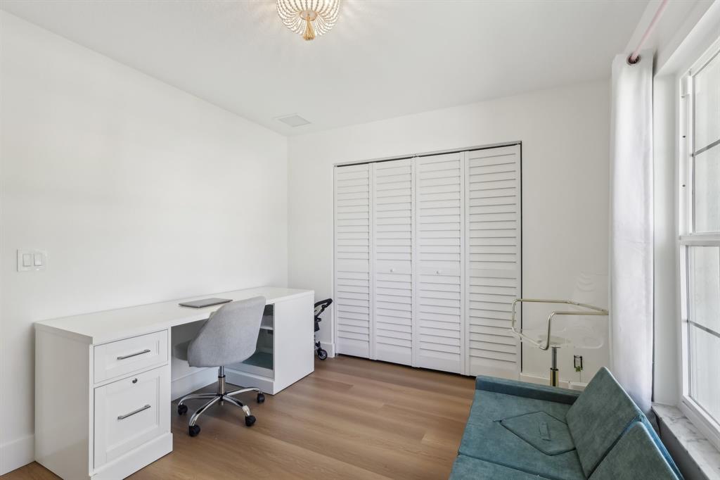 6254 Lucerne Street Jupiter, FL 33458 - Photo 19 of 30 a view of a workspace with furniture and a window