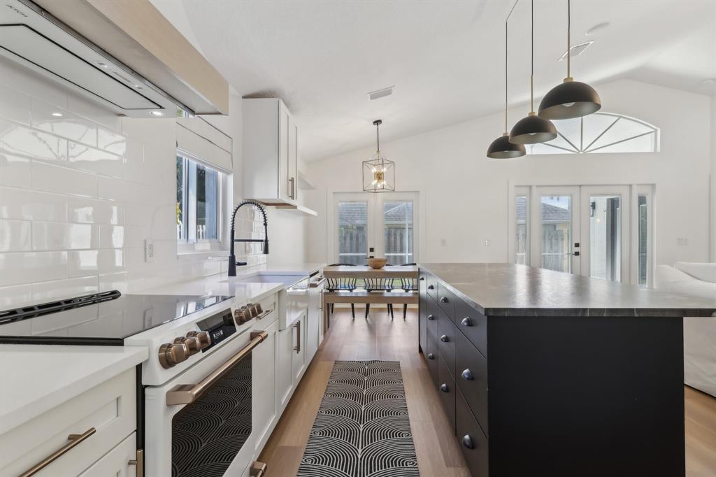 6254 Lucerne Street Jupiter, FL 33458 - Photo 5 of 30 a kitchen with stove a sink and cabinets