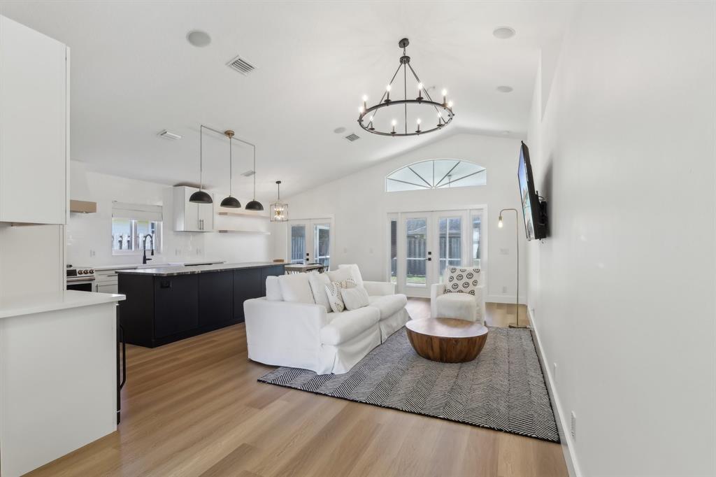 6254 Lucerne Street Jupiter, FL 33458 - Photo 6 of 30 a very nice looking room with a large window and chandelier