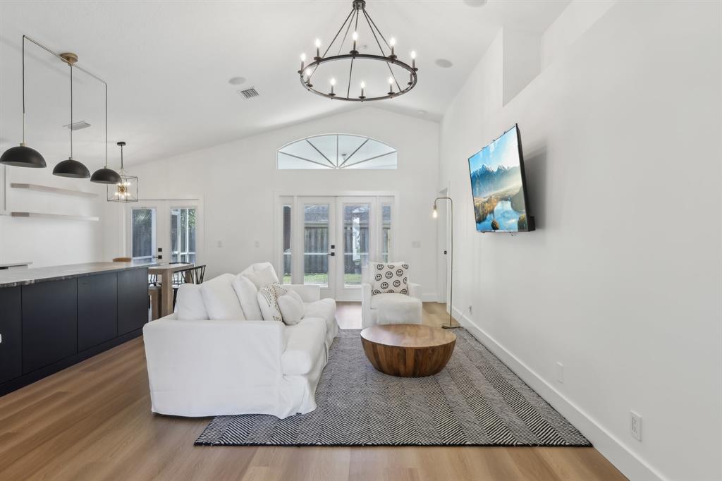 6254 Lucerne Street Jupiter, FL 33458 - Photo 8 of 30 a living room with furniture and a chandelier