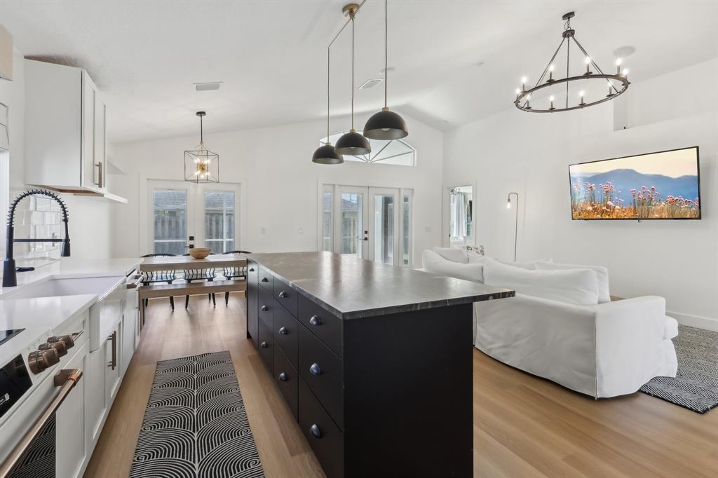 6254 Lucerne Street Jupiter, FL 33458 - Photo 9 of 30 a kitchen with a counter space a sink appliances and cabinets