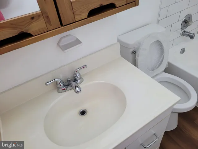 a bathroom with a sink and toilet