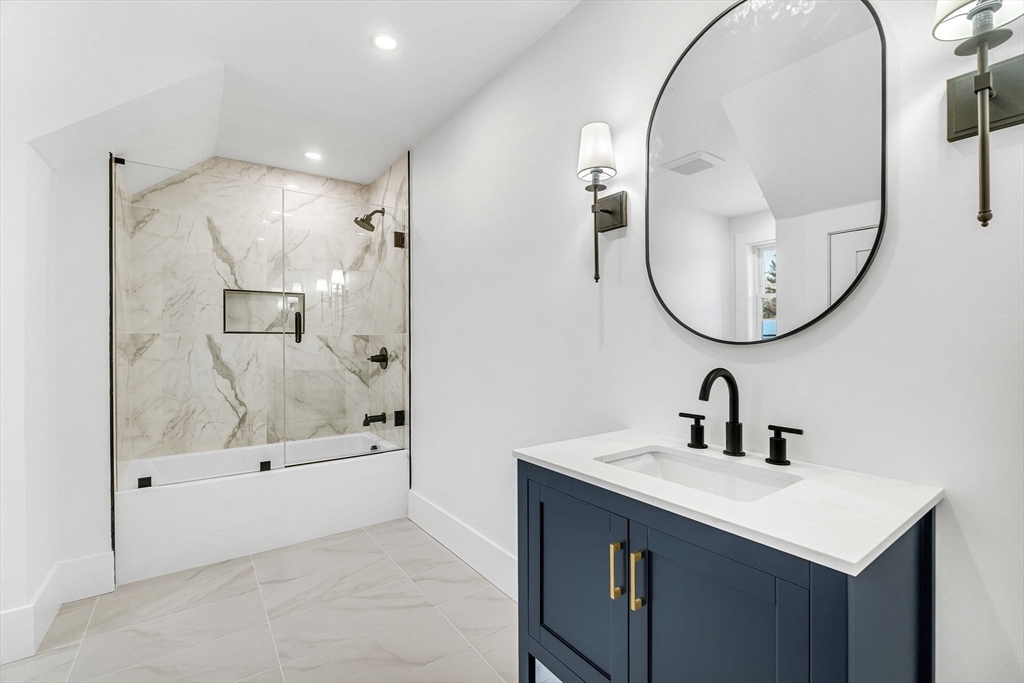 Lot 49 Barnard Hill Road Boylston, MA 01505 - Photo 24 of 26 a bathroom with a sink a mirror a glass door and shower