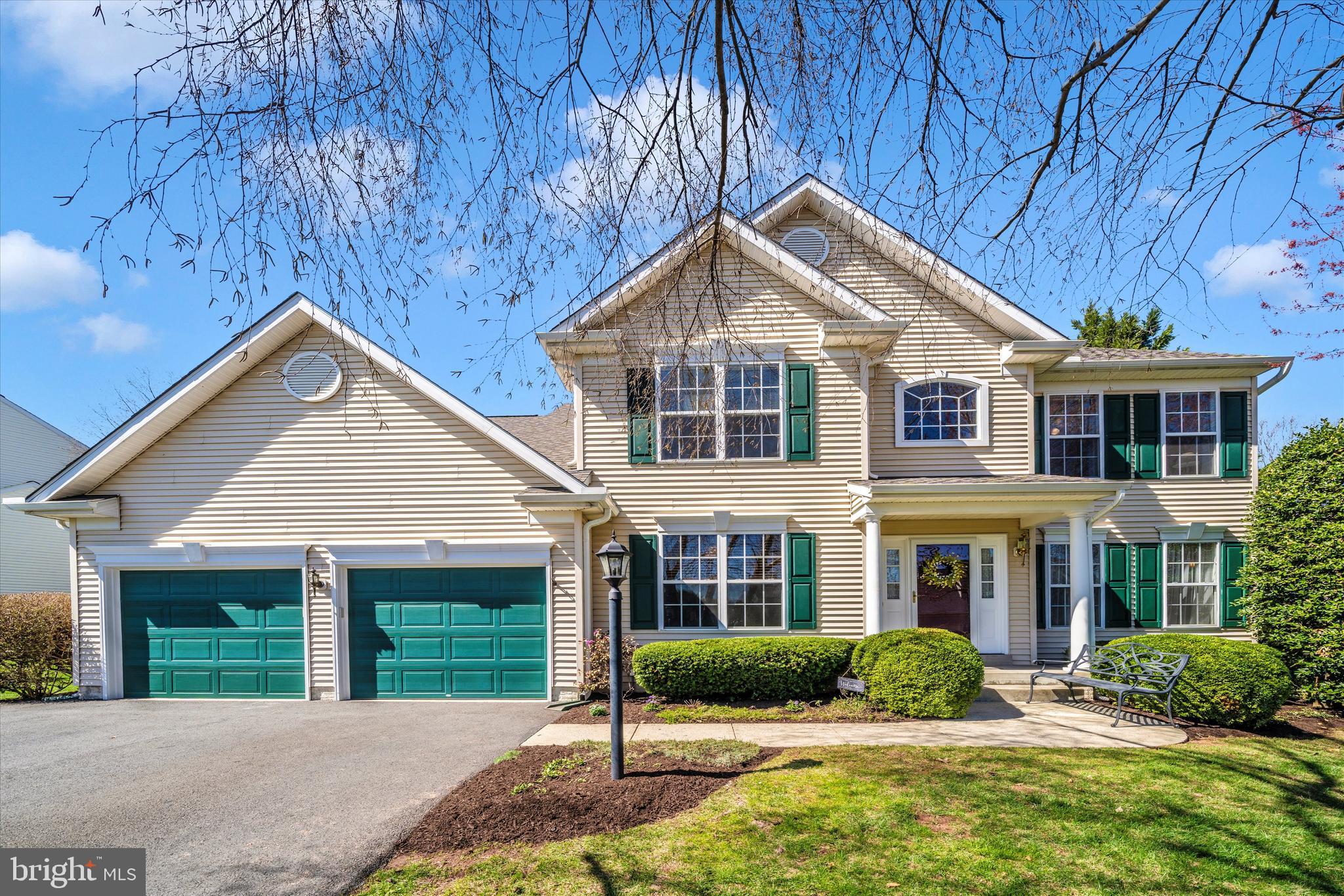 8321 Jordan Valley Way Frederick, MD 21702 - Photo 2 of 75 a front view of a house with a yard and potted plants