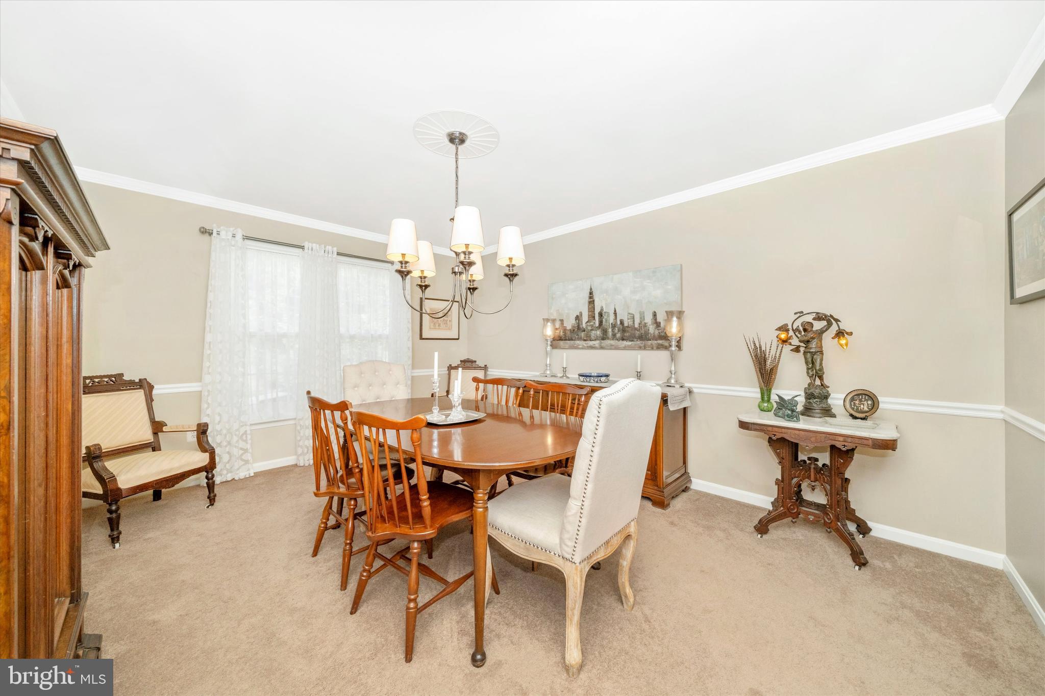 8321 Jordan Valley Way Frederick, MD 21702 - Photo 25 of 75 a view of a dining room with furniture and a chandelier