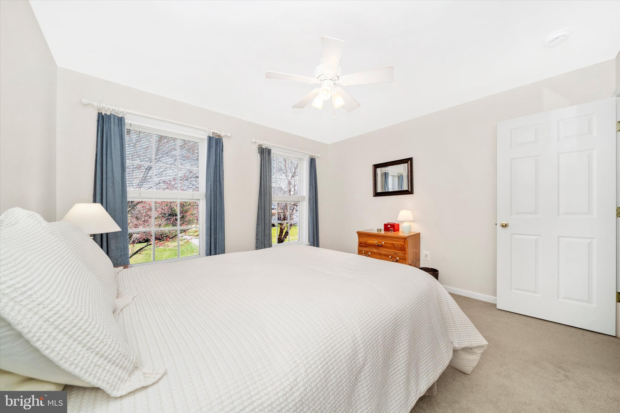 8321 Jordan Valley Way Frederick, MD 21702 - Photo 32 of 75 a bedroom with a bed a large window and painting on the wall