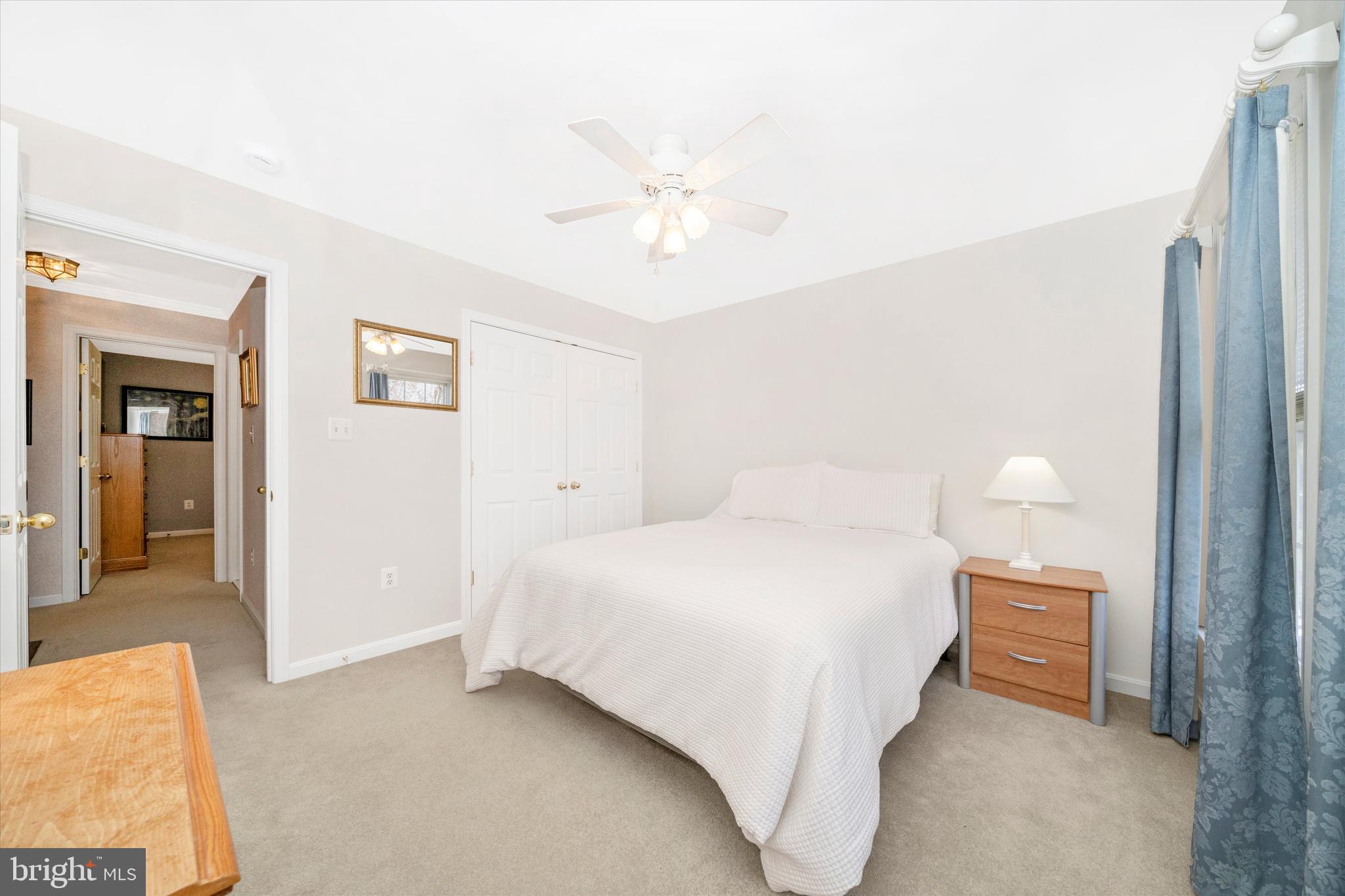 8321 Jordan Valley Way Frederick, MD 21702 - Photo 33 of 75 a bedroom with a bed and a lamp
