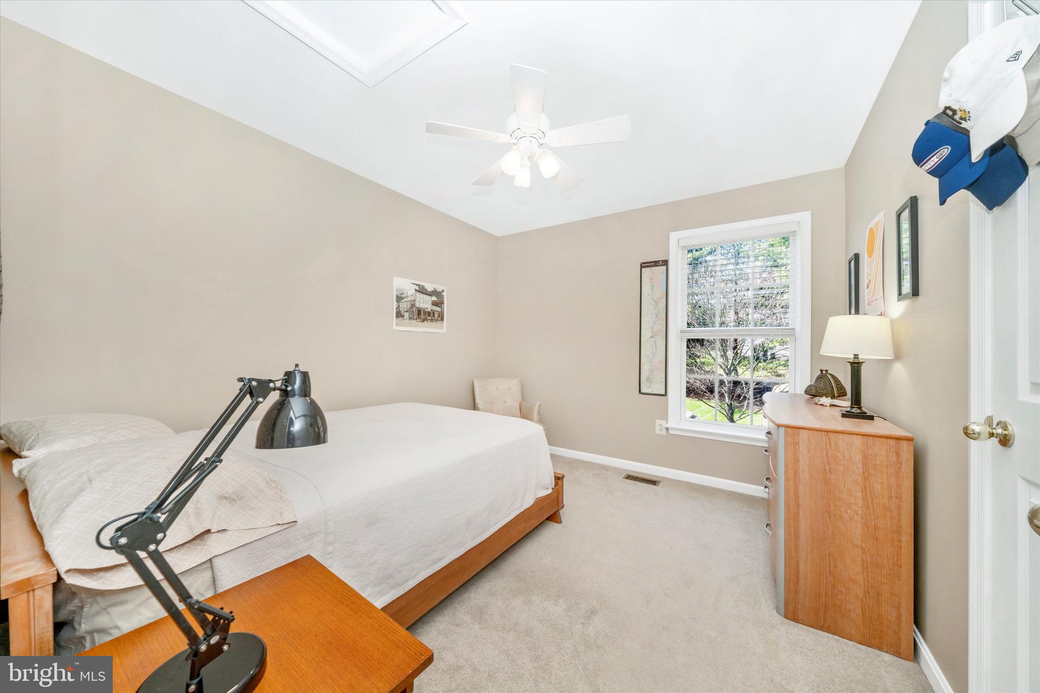 8321 Jordan Valley Way Frederick, MD 21702 - Photo 35 of 75 a bedroom with a bed and a chandelier