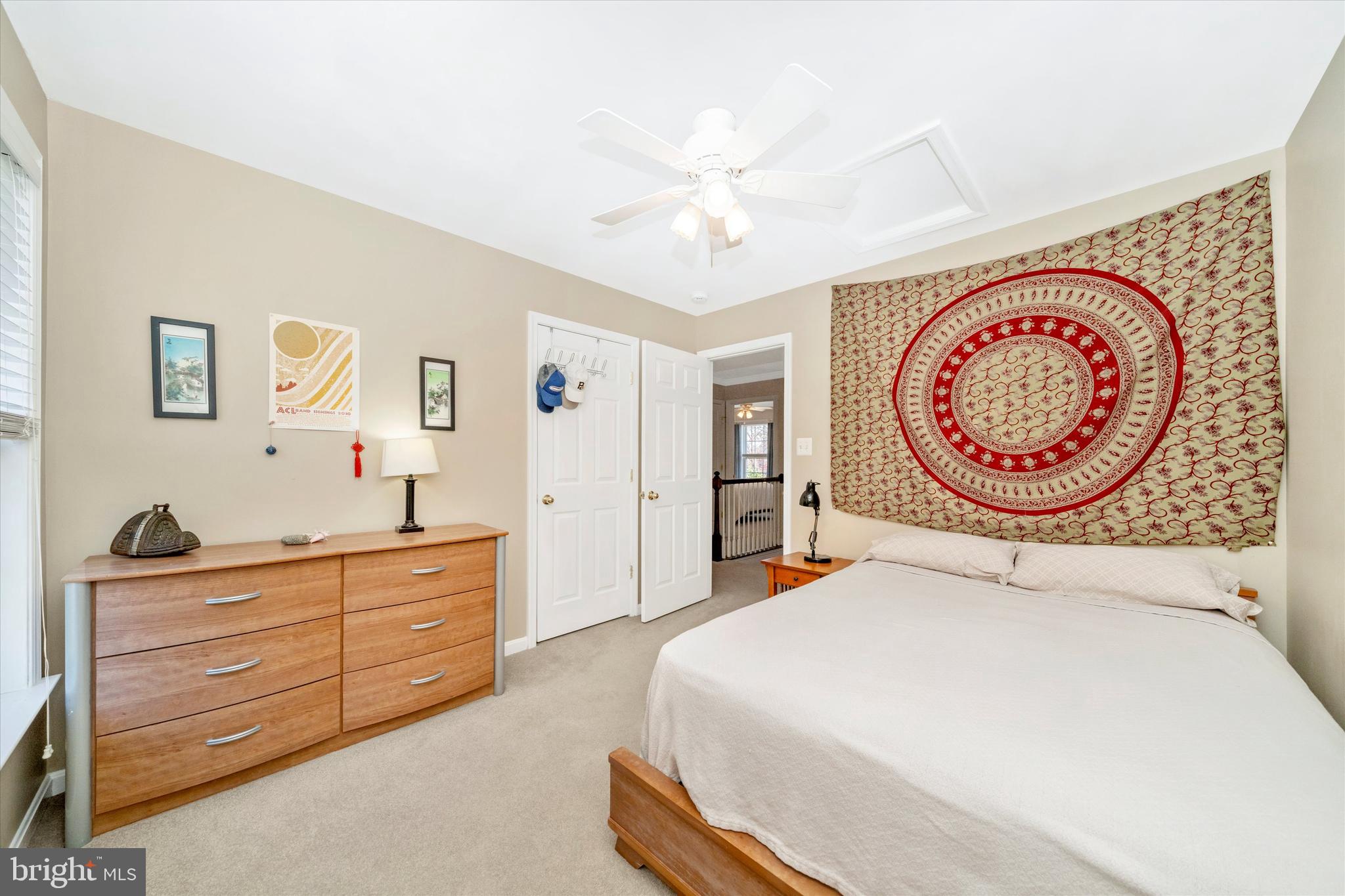 8321 Jordan Valley Way Frederick, MD 21702 - Photo 36 of 75 a bedroom with a bed and a chandelier