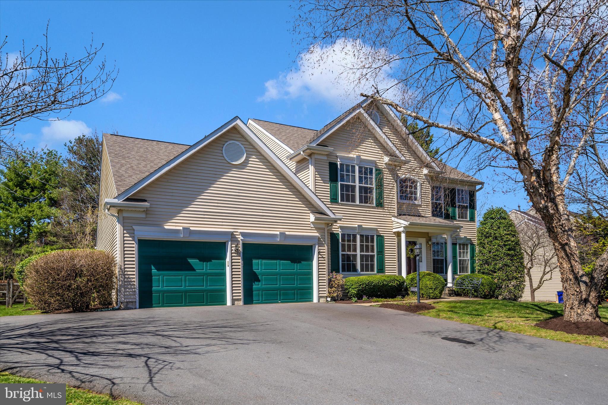 8321 Jordan Valley Way Frederick, MD 21702 - Photo 53 of 75 a front view of a house with a yard and garage
