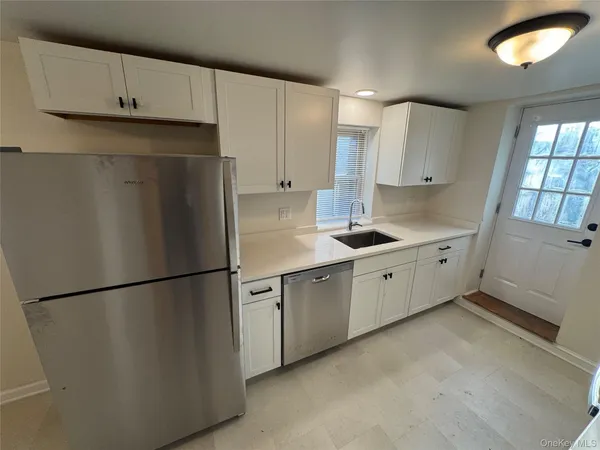 a kitchen with a stove and a sink
