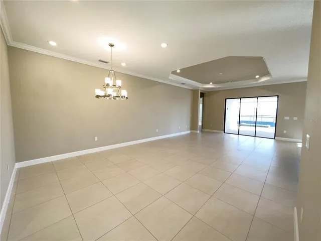 a kitchen with stainless steel appliances granite countertop a refrigerator a stove and a sink with cabinets