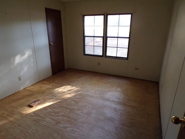 an empty room with windows