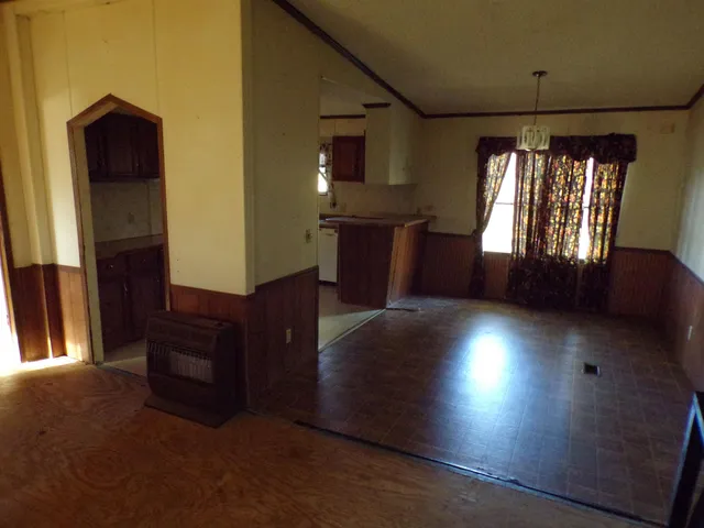 a view of a living room with furniture and a window