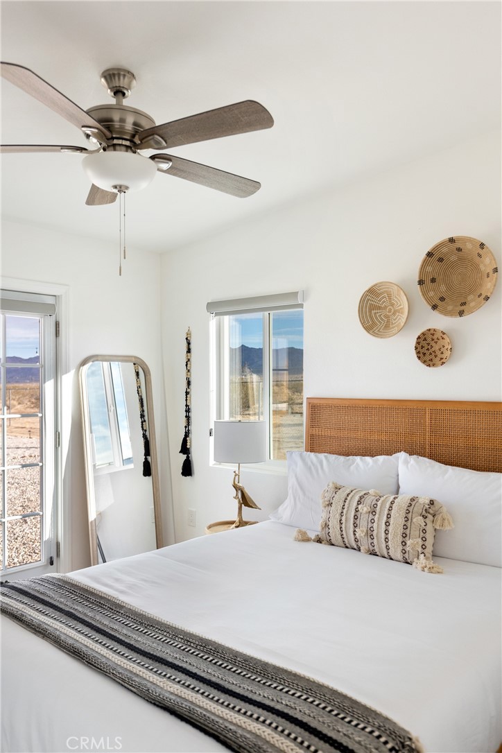 5737 Mojave Ranch Road Joshua Tree, CA 92252 - Photo 16 of 47 a bedroom with a bed and window