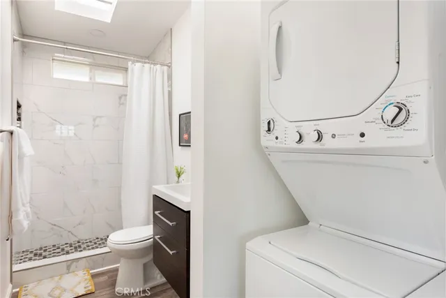 a bathroom with a toilet and a mirror