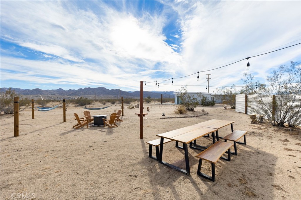 5737 Mojave Ranch Road Joshua Tree, CA 92252 - Photo 27 of 47 a view of a terrace with chairs